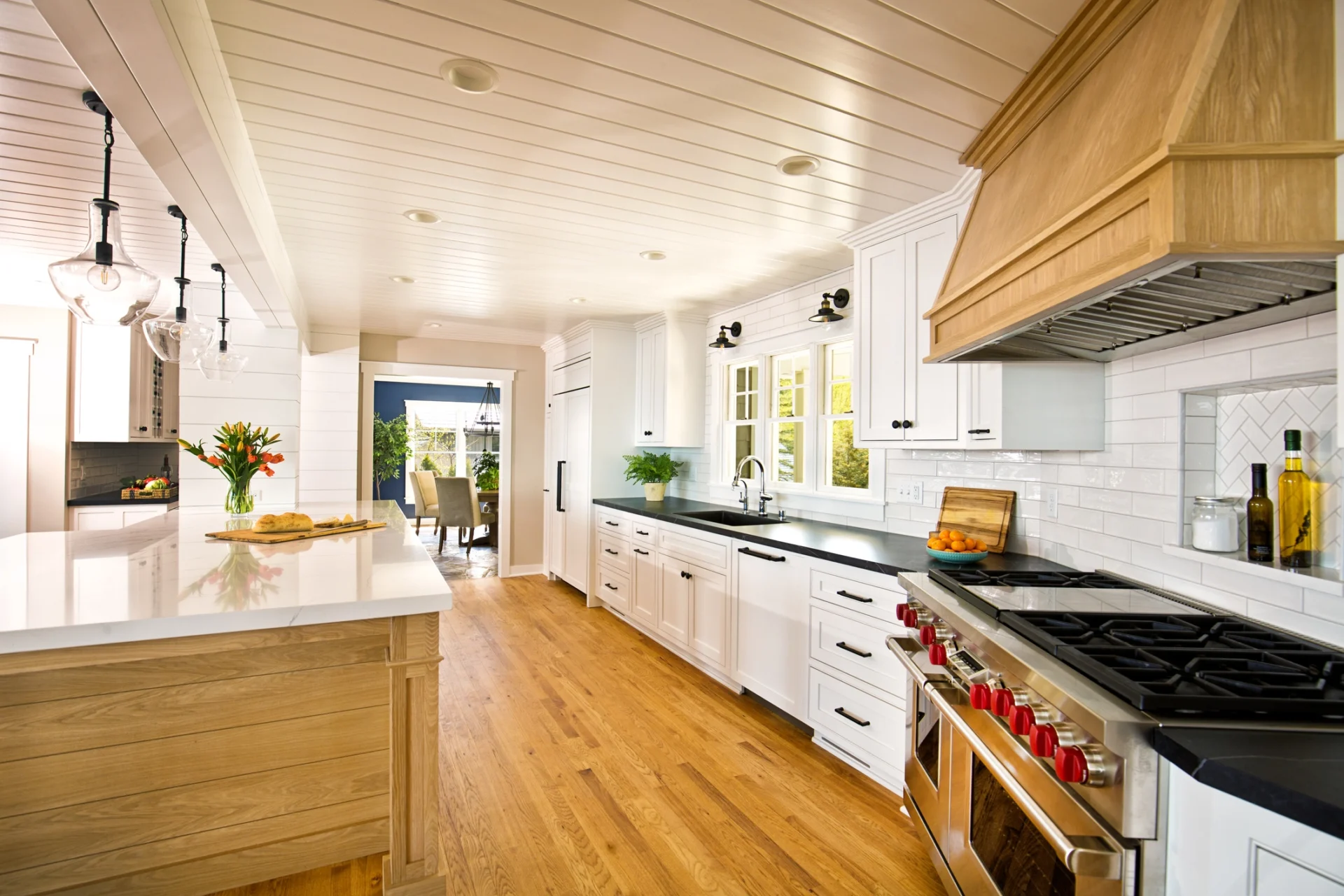 Bright kitchen featuring white cabinetry
