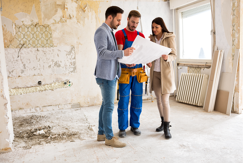 People reviewing renovation plans in a room